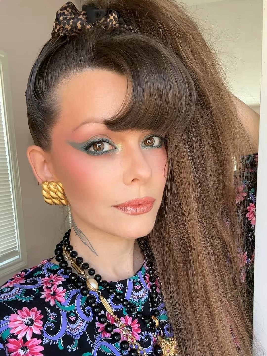 3. Sky-High Side Ponytail with Dark Brown Hair - 80S Hairstyles