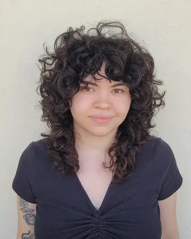 6. Dark Chocolate Curly Wolf Cut - 80S Hairstyles