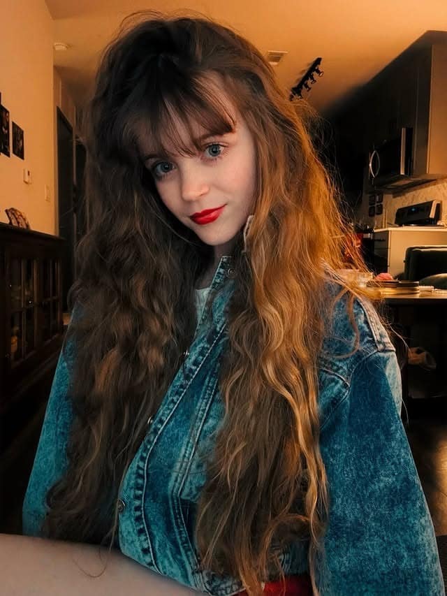 9. Long Feathered Brunette Hair with Wispy Bangs - 80S Hairstyles