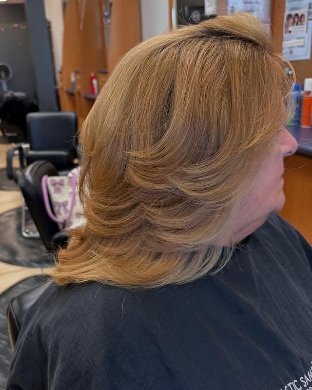 11. Feathered Honey Blonde Layered Blowout - 80S Hairstyles