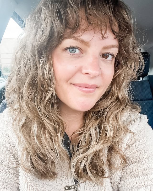 12. Sandy Blonde Curly Shag with Wispy Bangs - 80S Hairstyles