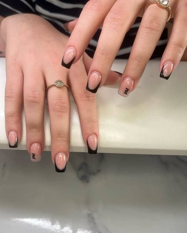 5. Short Black French Tip Nails - short black nail ideas