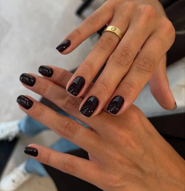 7. Short Glossy Black Minimalist Nails - short black nail ideas