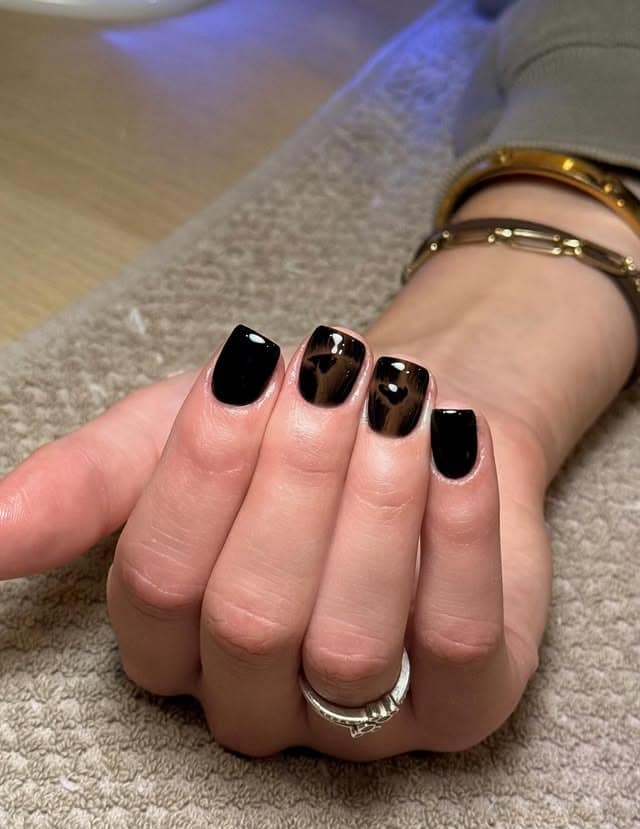 15. Glossy Black Tortoiseshell Short Nails - short black nail ideas