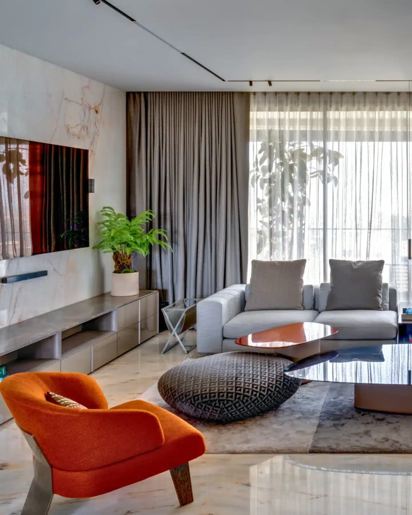 2. Modern Orange and Gray Marble Living Room Idea - orange and gray living room ideas
