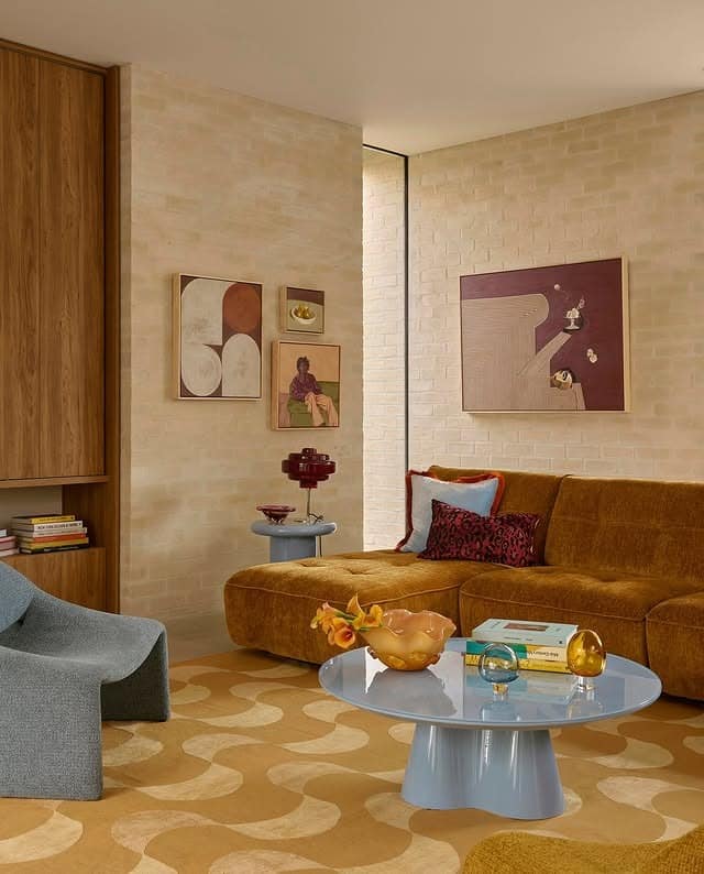 3. Earthy Orange Sofa and Gray Accent Chair Living Room - orange and gray living room ideas