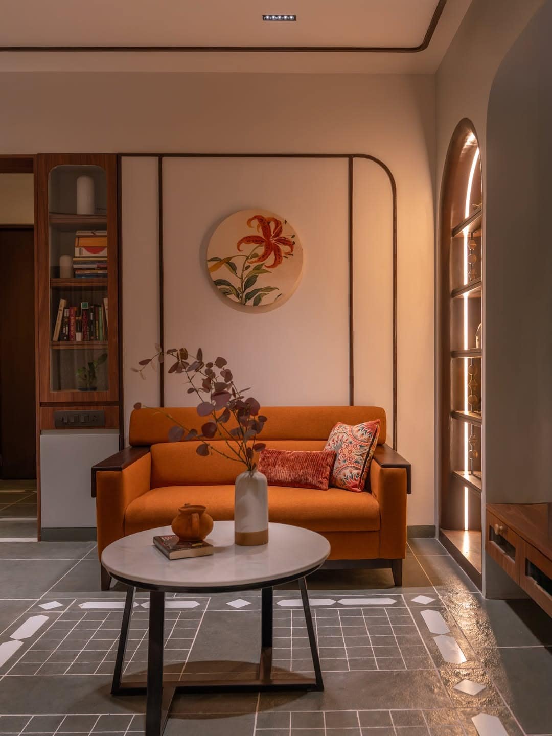 6. Cozy Orange Loveseat and Gray Tile Living Room - orange and gray living room ideas