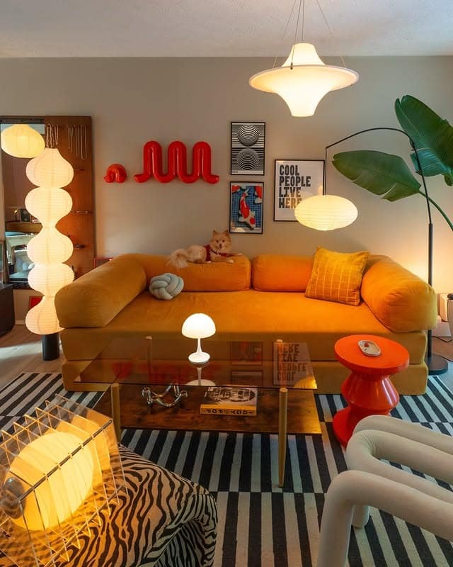 7. Bold Orange Sofa with Gray Modern Living Room Decor - orange and gray living room ideas
