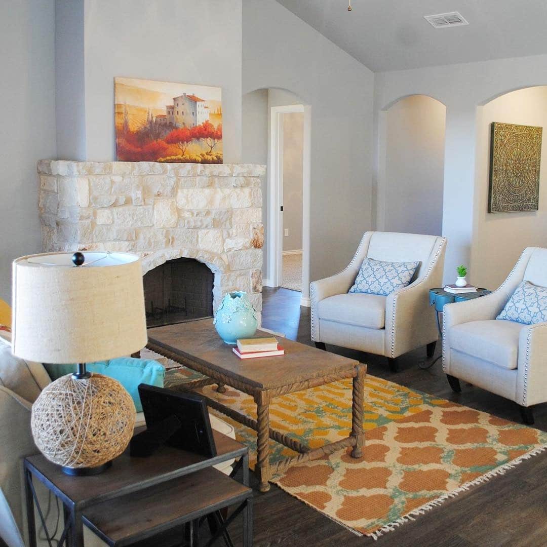 13. Soft Gray Living Room with Orange Patterned Rug - orange and gray living room ideas