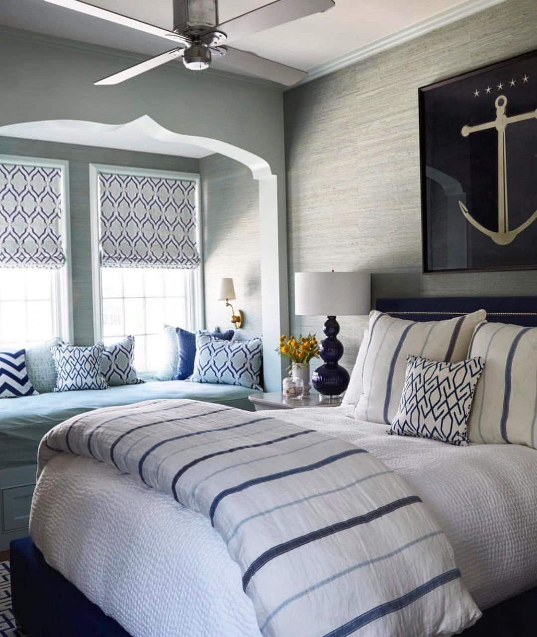 1. Coastal Window Seat Nautical Bedroom Idea in Soft Blue and White - nautical bedroom ideas
