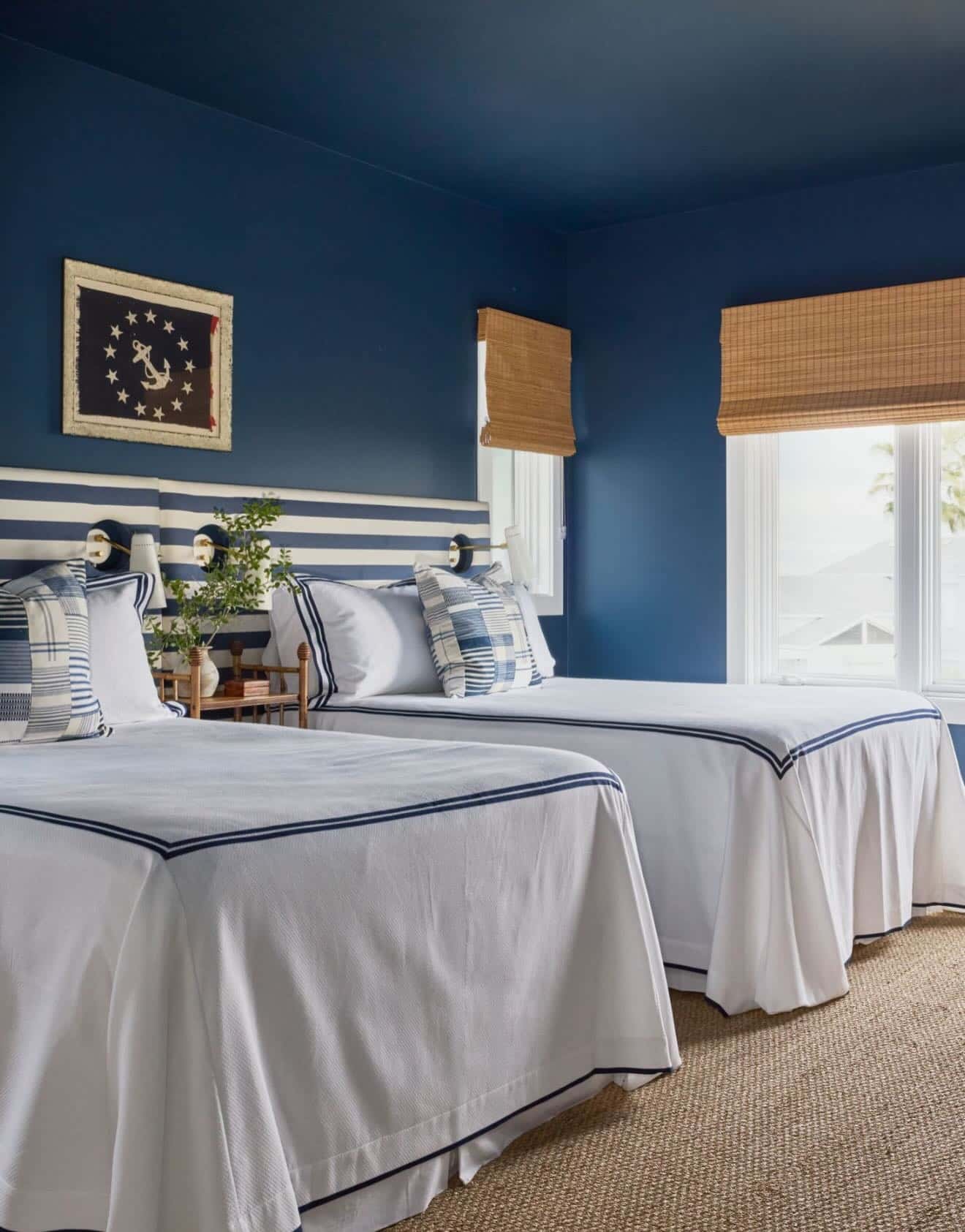 2. Bold Navy Wall Nautical Bedroom Idea with Twin Beds - nautical bedroom ideas