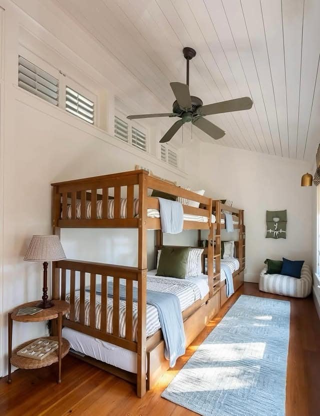 13. Coastal Bunk Room Nautical Bedroom Idea in Warm Wood and Blue - nautical bedroom ideas
