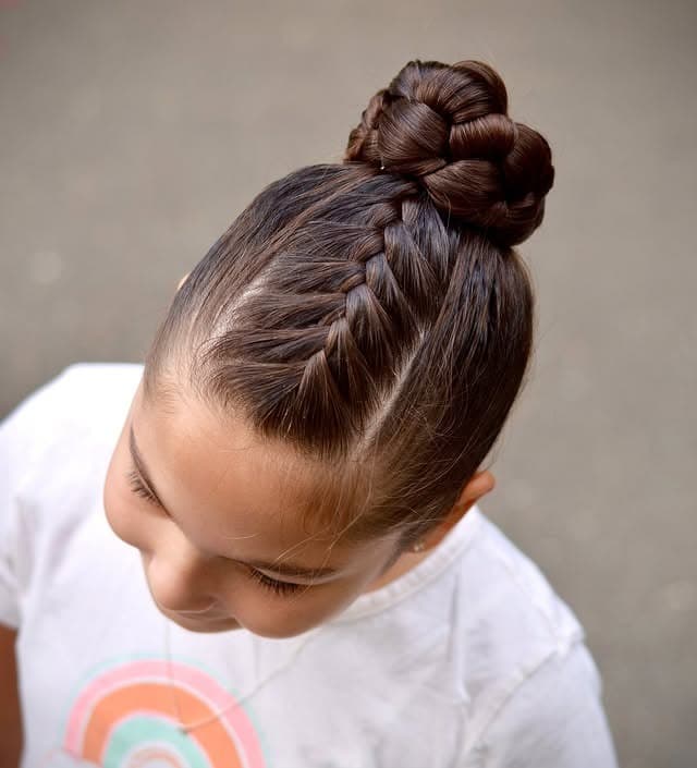3. Braided High Bun on Dark Chocolate Brown Hair - Volleyball Hairstyles