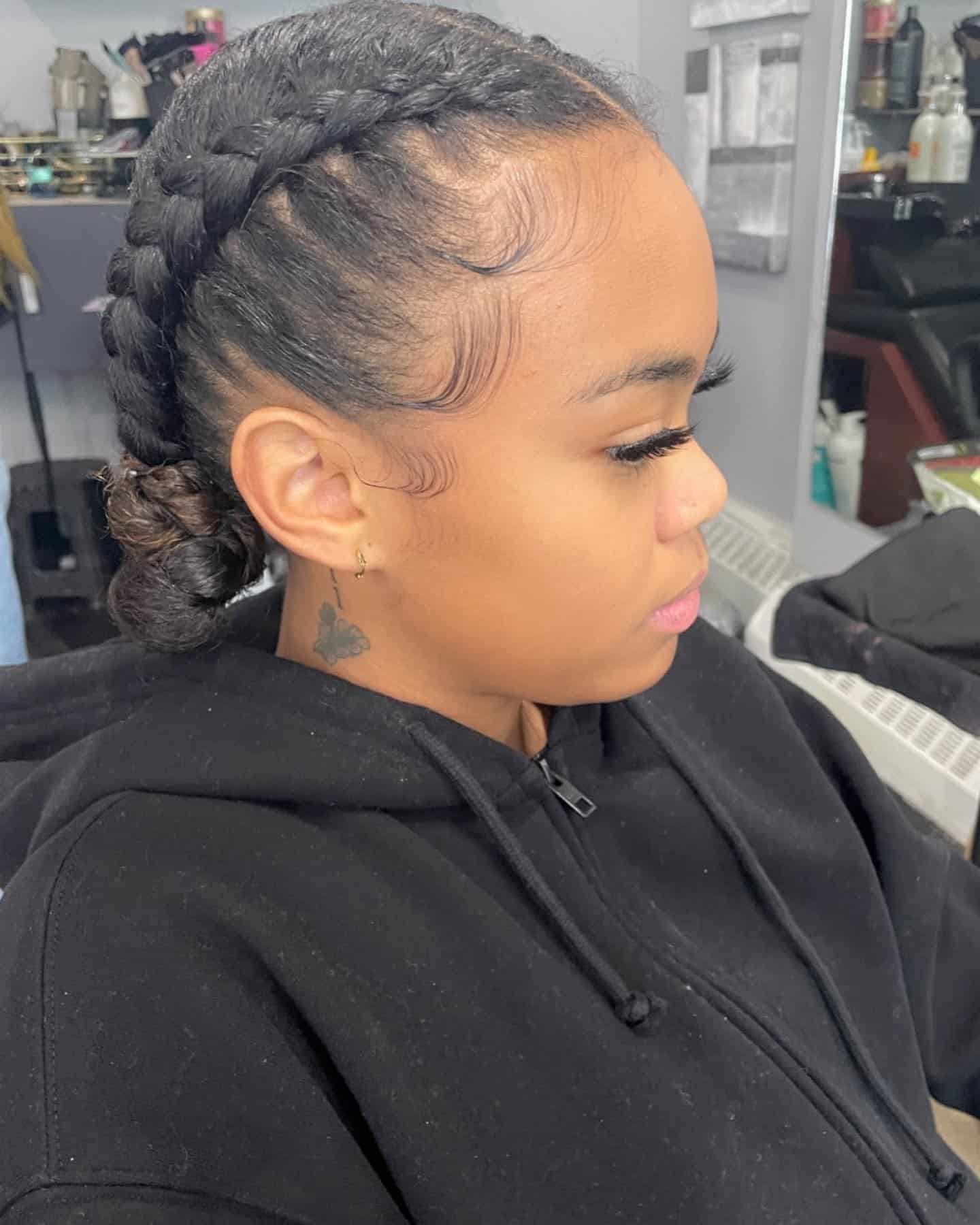 5. Double Dutch Braided Low Bun on Natural Black Hair - Volleyball Hairstyles
