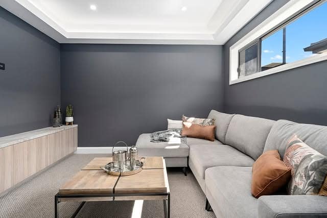 4. Grey and White Living Room with Charcoal Feature Walls - grey and white living room ideas