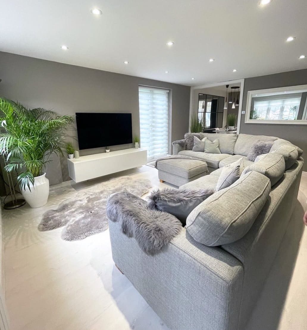 5. Contemporary Grey and White Living Room with Plush Textures - grey and white living room ideas