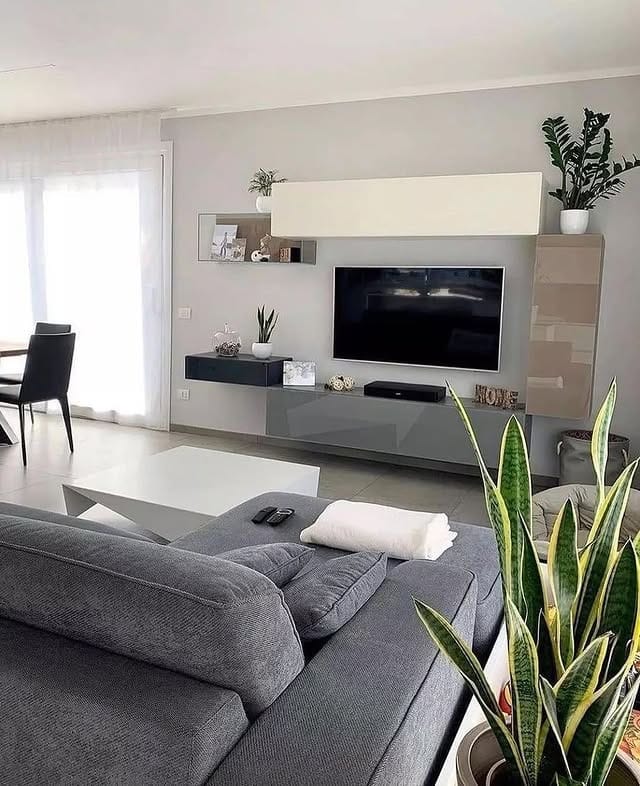 7. Minimalist Grey and White Living Room with Floating Storage - grey and white living room ideas