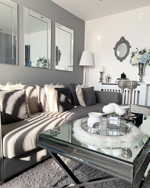 10. Glam Grey and White Living Room with Mirrored Decor - grey and white living room ideas