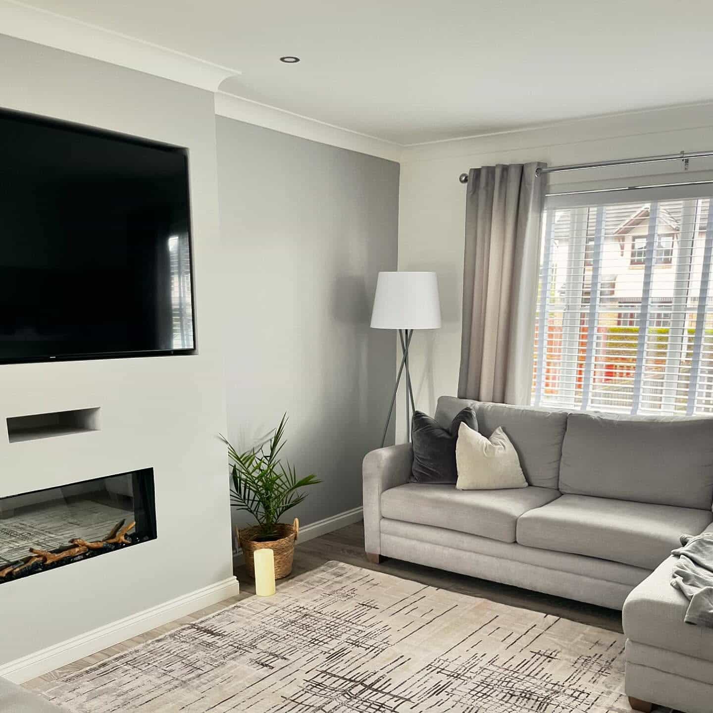 15. Cozy Grey and White Living Room with Fireplace - grey and white living room ideas