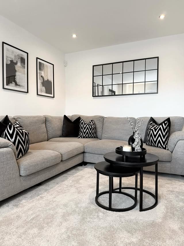 16. Modern Grey and White Living Room with Black Decor - grey and white living room ideas