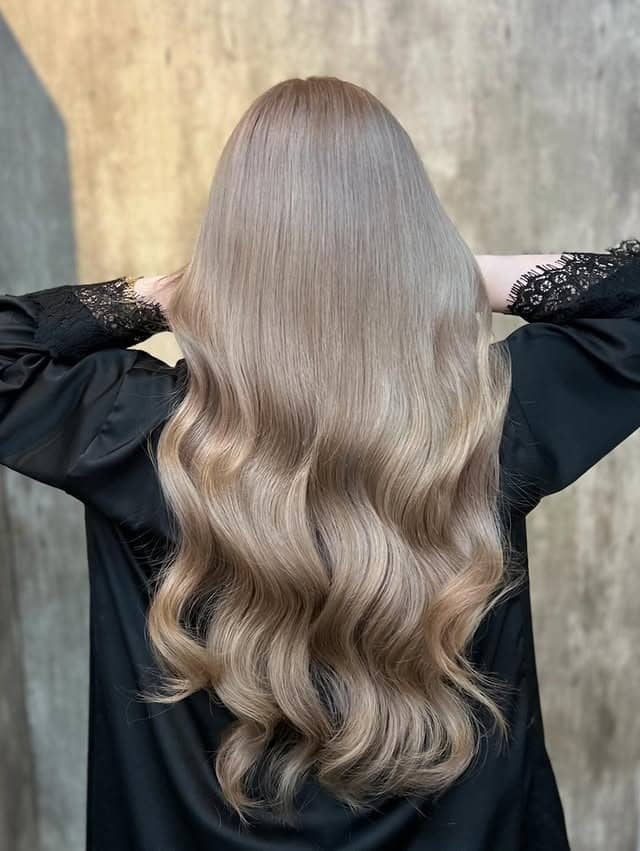 14. Glossy Hollywood Waves with Creamy Milk Tea Blonde - Milk Tea Hair Color