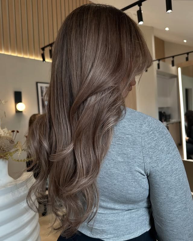 17. Voluminous Layers with Cool Milk Tea Brunette - Milk Tea Hair Color