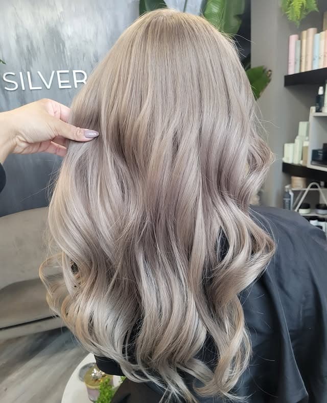 20. Silky Long Waves with Pearl Milk Tea Hair Color - Milk Tea Hair Color