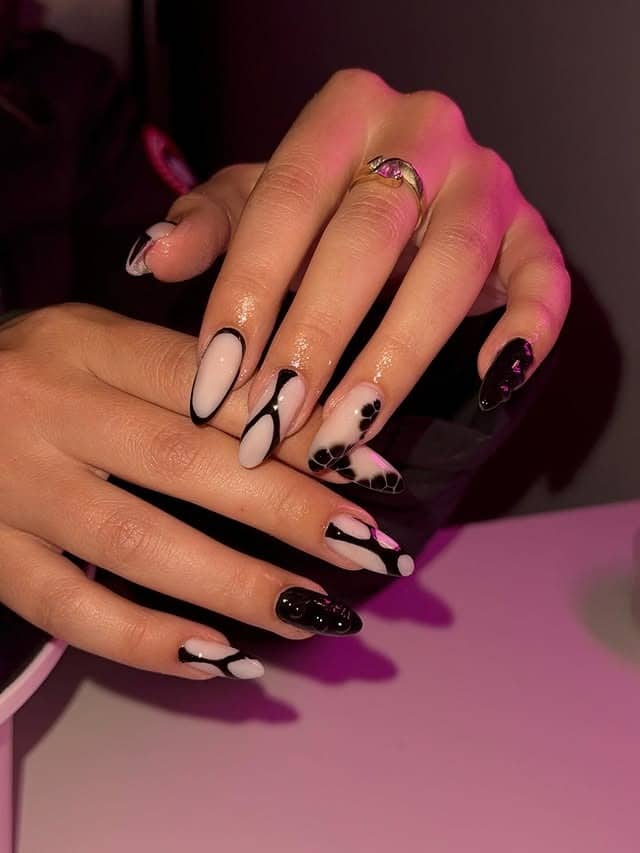 1. Black and White Abstract Almond Nails - abstract nail ideas