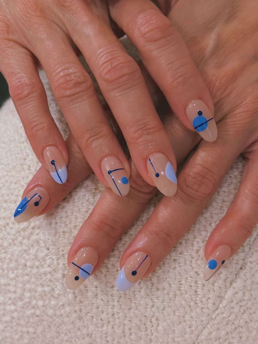 5. Blue Minimalist Abstract Almond Nails - abstract nail ideas