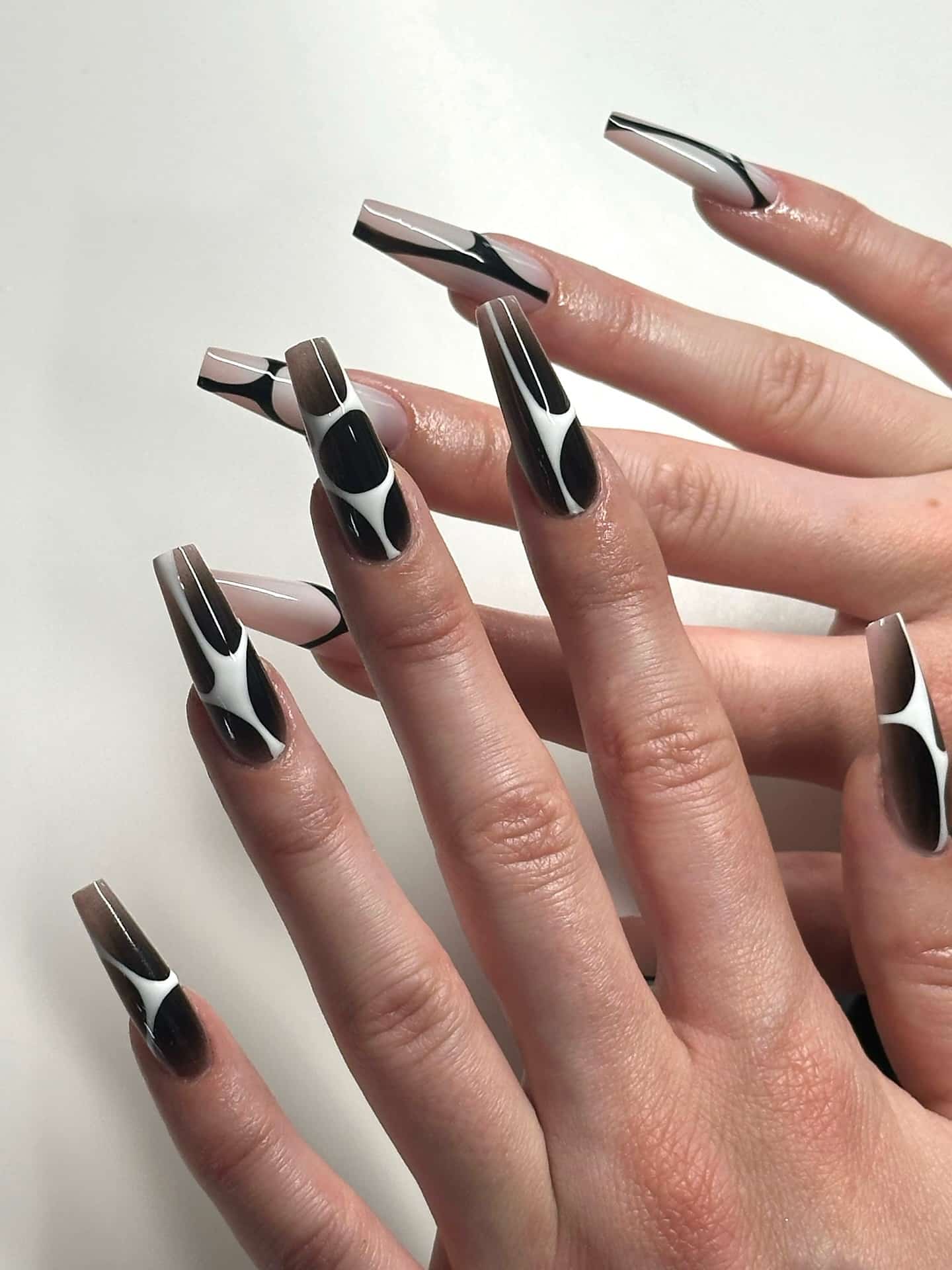 7. Black and White Abstract Coffin Nails - abstract nail ideas