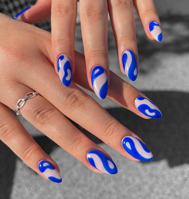 10. Cobalt Blue Abstract Almond Nails - abstract nail ideas