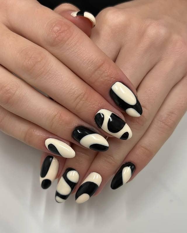 13. Black and Cream Abstract Almond Nails - abstract nail ideas