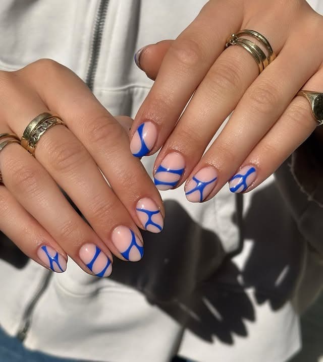 15. Royal Blue Abstract Short Oval Nails - abstract nail ideas