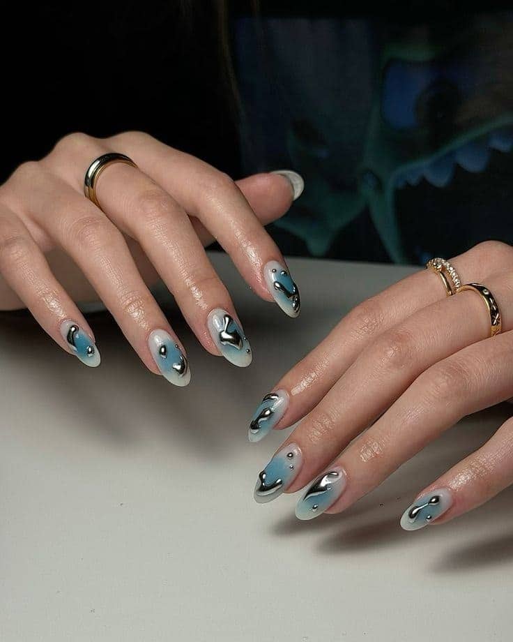 18. Blue Chrome Abstract Almond Nails - abstract nail ideas