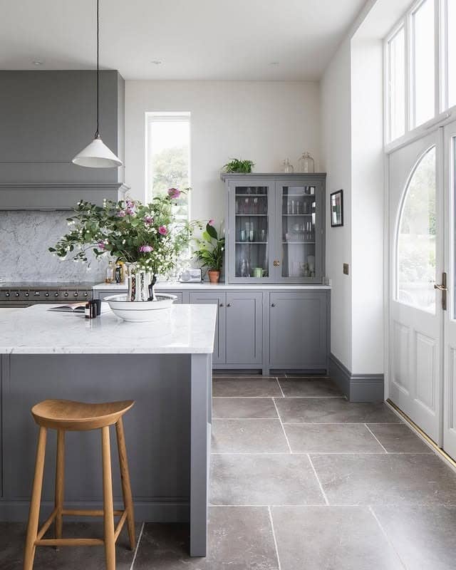 8. Soft Gray Kitchen Cabinets with Bright Natural Light - gray kitchen cabinet ideas