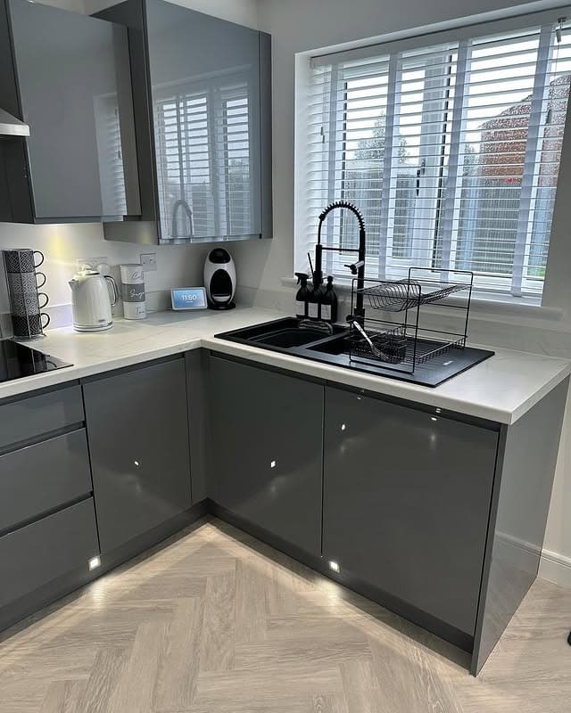12. Glossy Dark Gray Kitchen Cabinets with Black Accents - gray kitchen cabinet ideas