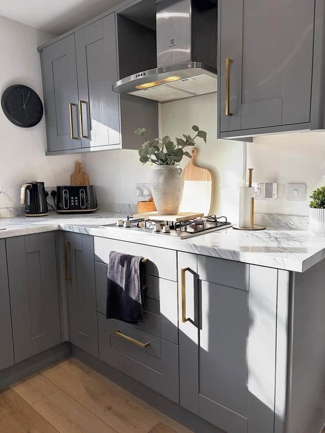 15. Medium Gray Kitchen Cabinets with Brass Pulls - gray kitchen cabinet ideas