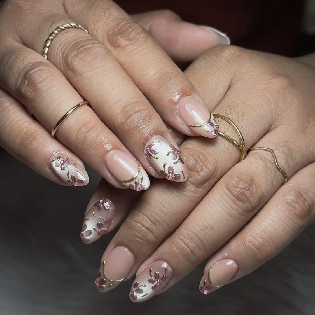 1. Pink Floral Almond Nails with Gold Outline - birthday nail ideas