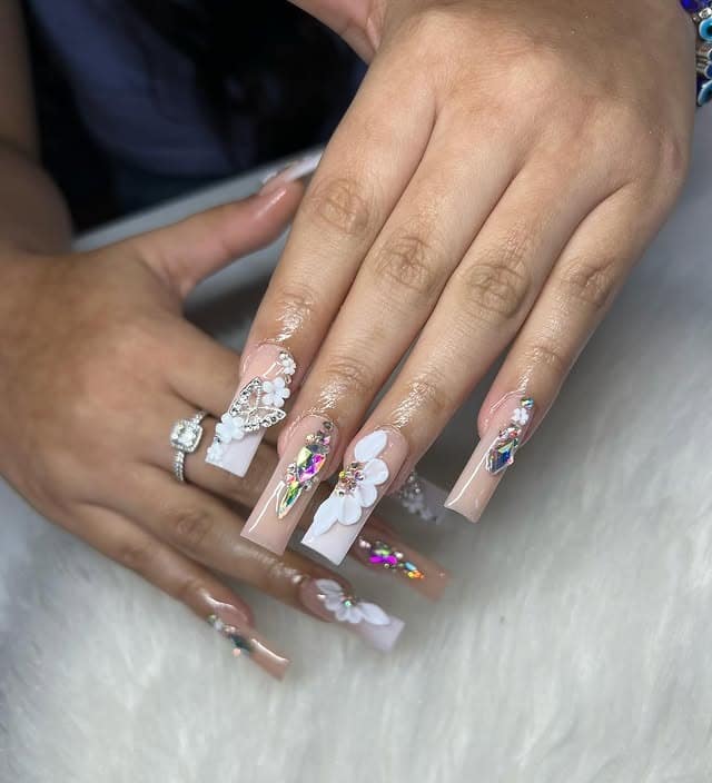 10. Nude Coffin Nails with White Flowers and Crystal Gems - birthday nail ideas