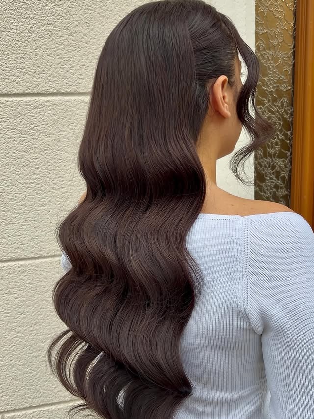 9. Sleek Hollywood Waves with Dark Espresso Hair - Wavy Hairstyles