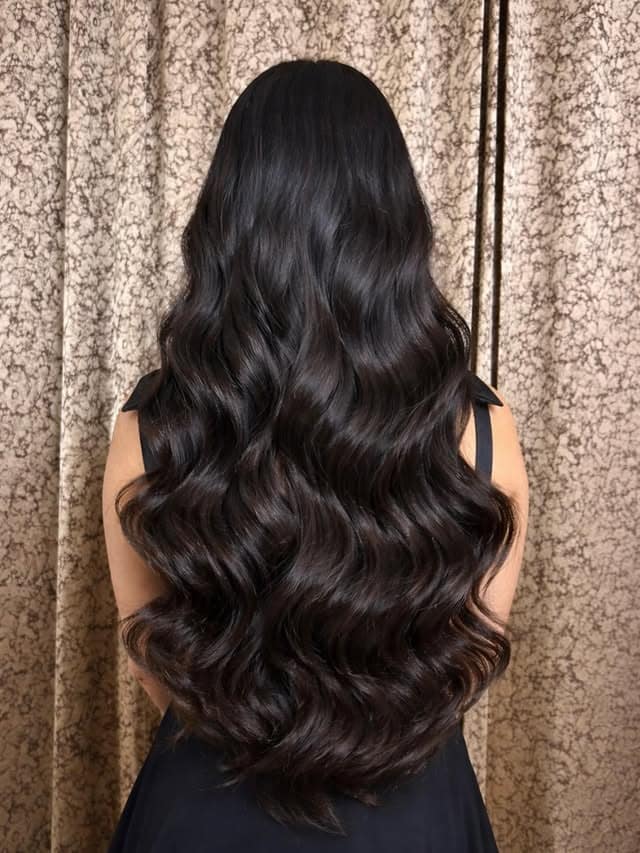 17. Extra Long Glossy Waves with Soft Black Hair - Wavy Hairstyles