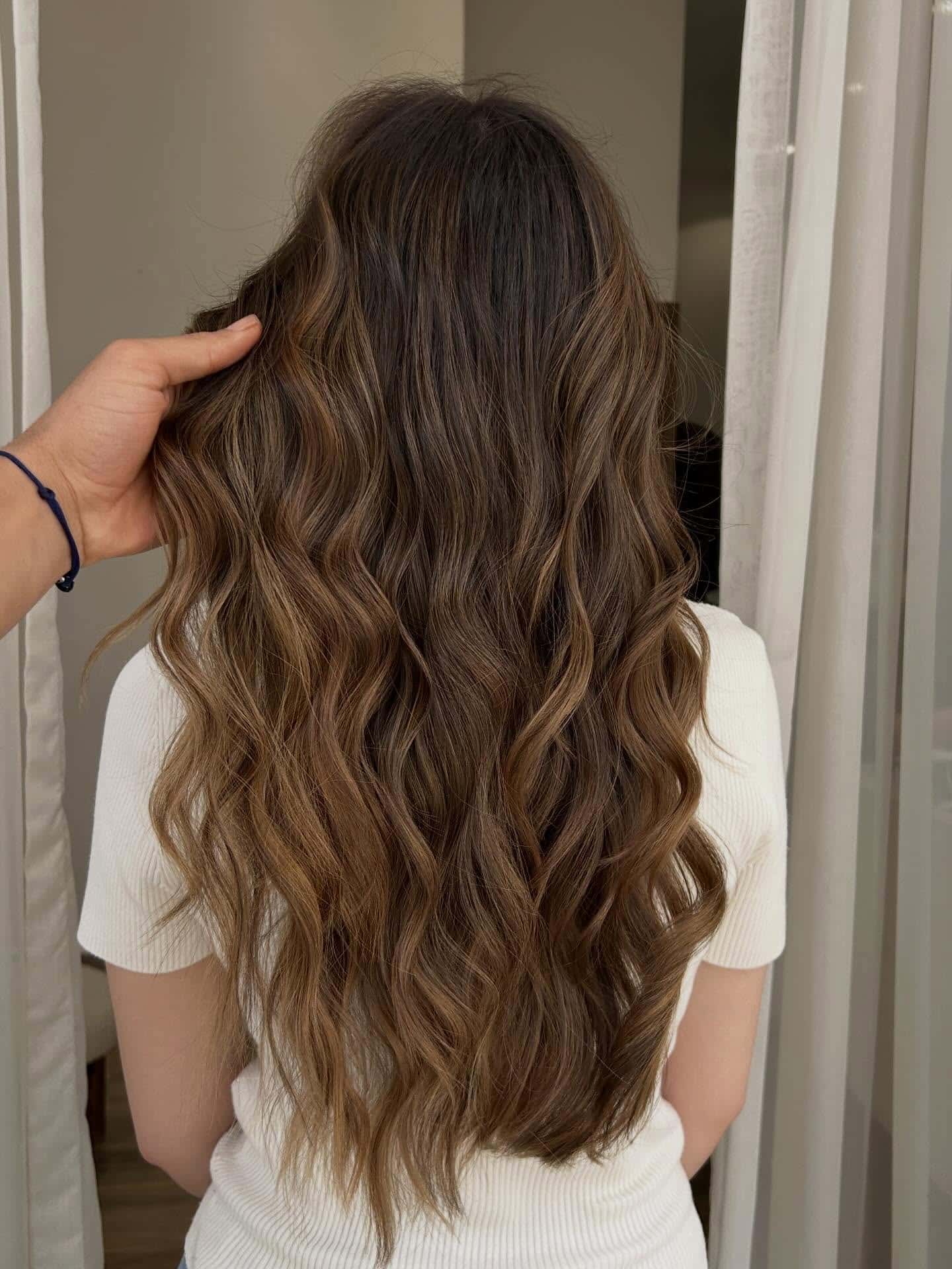 20. Soft Layered Waves with Cool Brown Balayage - Wavy Hairstyles