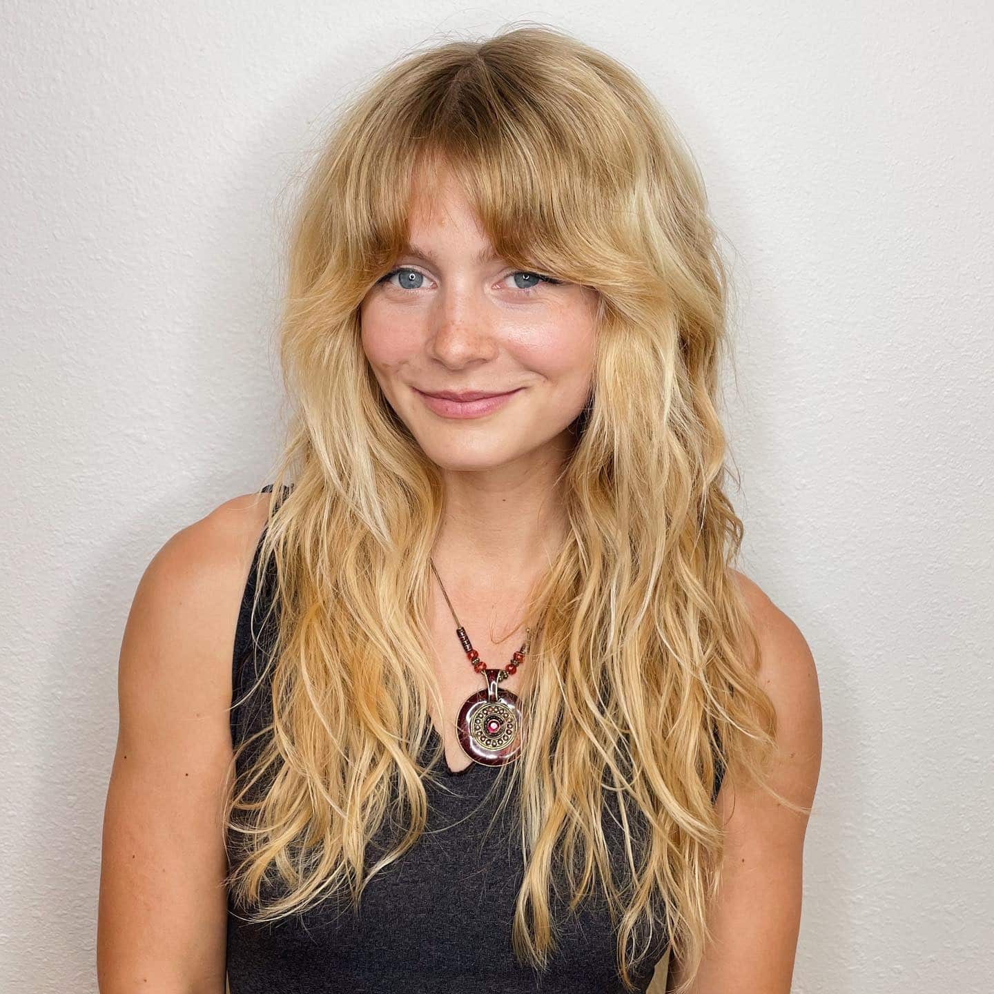 4. Golden Blonde 70s Shag with Curtain Bangs - 70S Hairstyles