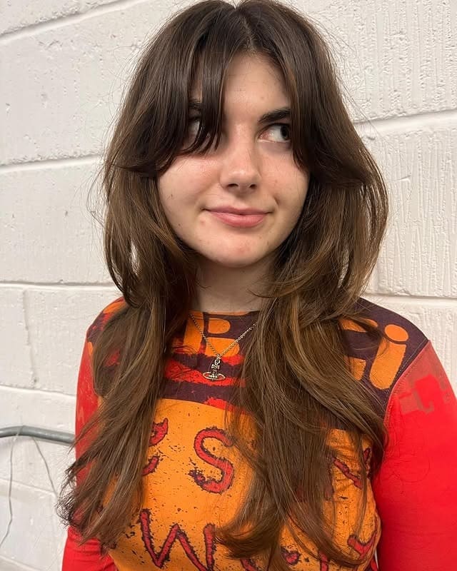 5. Chocolate Brown 70s Layered Cut with Long Curtain Bangs - 70S Hairstyles