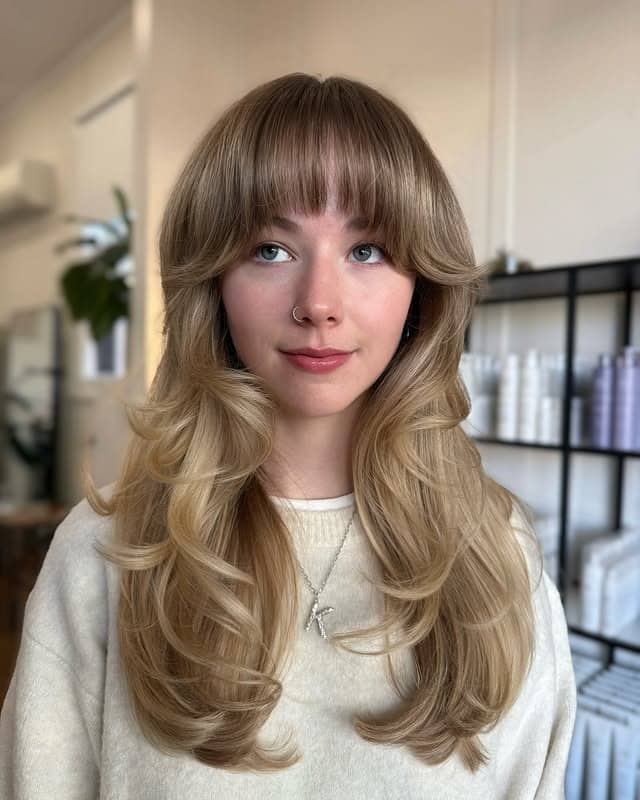 11. Beige Blonde 70s Butterfly Layers with Full Fringe - 70S Hairstyles