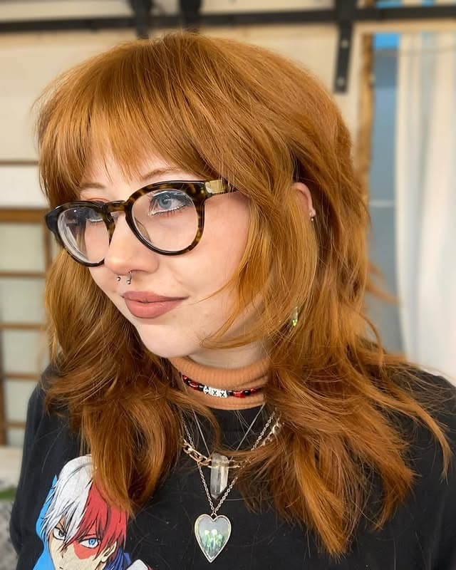 22. Copper Ginger 70s Layered Shag with Full Bangs - 70S Hairstyles