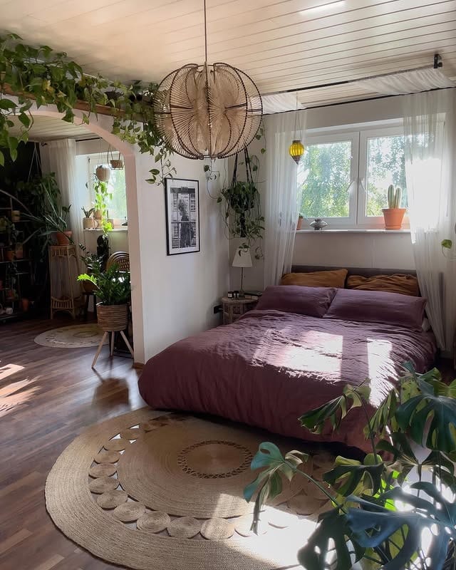 14. Boho Bedroom Ideas with Plants and Deep Plum Bedding - bedroom ideas with plants