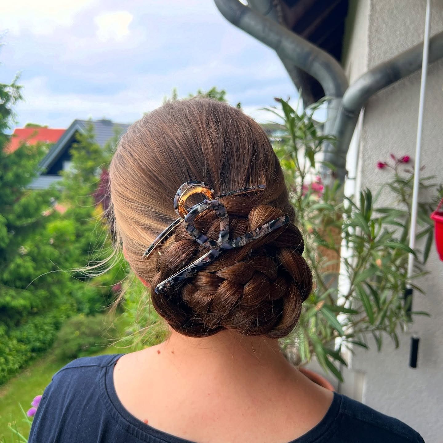 2. Braided Light Brown Claw Clip Updo - Claw Clip Hairstyles