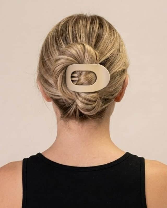 21. Soft Blonde Twisted Claw Clip Bun - Claw Clip Hairstyles