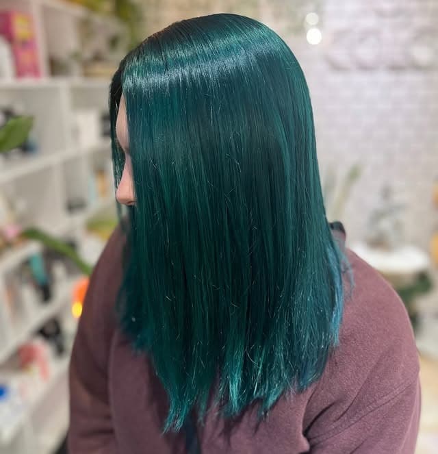 10. Sleek Dark Teal Blunt Lob - Teal Hair Color